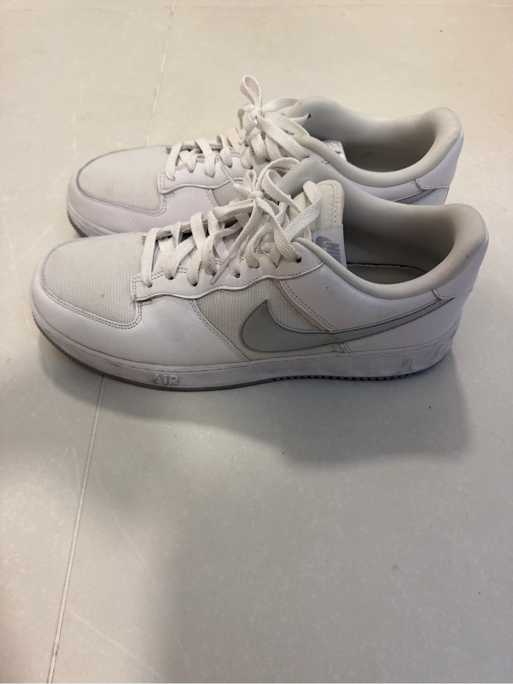 Nike White Low-Top Sneakers with Light Gray Swoosh
